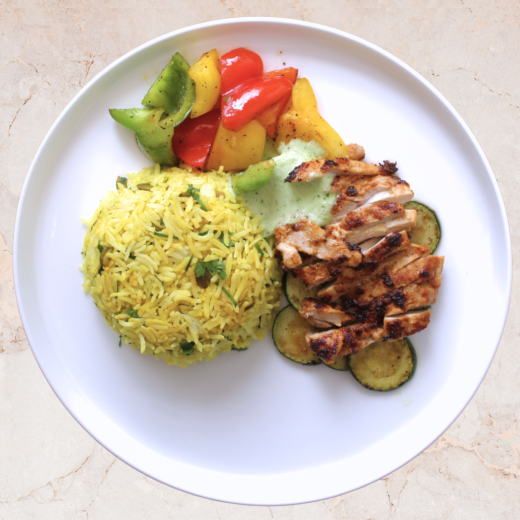 Chicken Shawarma with Roasted vegetables, Rice Pilaf & Garlic Sauce